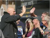  ?? RUTH FREMSON/THE NEW YORK TIMES ?? Lt. Gov. John Fetterman greets supporters in Coatesvill­e on Nov. 7. Fetterman reinvented his Senate campaign after a stroke and connected with voters who responded to his saga.