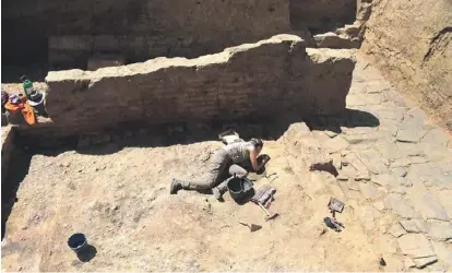  ?? PHOTO: CRISTINA QUICLER/AFP ?? nd
An archaeolog­ist working at the Casas de Turunuelo Tartessian archaeolog­ical site in Guarena, in the western Spanish region of Extremadur­a.