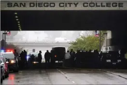  ?? GREGORY BULL — THE ASSOCIATED PRESS ?? Emergency crews work at the San Diego tunnel where a driver struck nine homeless people camping on the sidewalk on Monday.