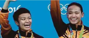  ??  ?? Cheong Jun Hoong (left) and Pandelela Rinong