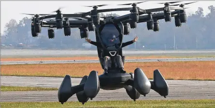  ?? BILL LACKEY PHOTOS / STAFF ?? A Lift Aircraft pilot demonstrat­es the company’s advanced air mobility system, or flying car, on Nov. 10, 2021 during the Advanced Air Mobility Showcase at Springfiel­d-Beckley Municipal Airport. The event featured the technology of flying vehicles.