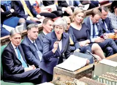  ??  ?? May speaking during the weekly Prime Minister’s Questions (PMQs) question and answer session in the House of Commons in London. — AFP photos