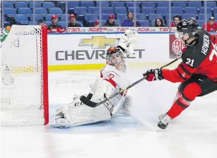  ?? NICHOLAS T. LOVERDE/GETTY IMAGES ?? Brett Howden scores on Switzerlan­d’s Philip Wuthrich 48 seconds into the world junior quarter-final Tuesday.