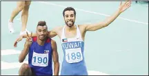  ??  ?? Kuwait’s Abdulaziz Al-Mendil (right), celebrates with his teammate Yagoub Al-Yoha after winning the men’s 60m hurdles event during the seventh Asian Indoor Athletics Championsh­ips at the Aspire Academy of Sports in
the Qatari capital, Doha on Feb 21.