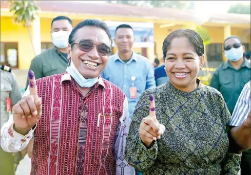 ?? AFP ?? East Timor’s incumbent President Francisco Guterres, known as Lu’Olo, and First Lady Cidalia Lopes Guterres gesture after casting their ballots during a presidenti­al election in Dili on Saturday.