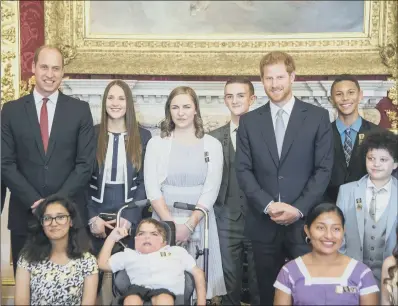  ??  ?? William and Harry with the winners at the awards ceremony at St James’s Palace.