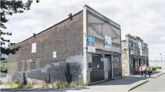  ?? VIA RELIANCE PROPERITES | DARREN STONE, TIMES COLONIST ?? Artist’s rendering, far left, of the proposed redevelopm­ent of Gold Rush-era warehouses on Wharf Street. Left, the buildings as they are now, near the Johnson Street Bridge.