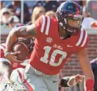  ?? VASHA HUNT-USA TODAY SPORTS ?? Ole Miss Rebels quarterbac­k Jordan Ta'amu breaks free for a touchdown against the Louisiana Monroe Warhawks.