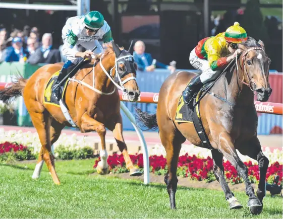  ?? Picture: GETTY IMAGES ?? Religify chases Lucky Hussler home in the Schweppes Crystal Mile at Moonee Valley in the spring.