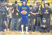  ?? BEN MARGOT ASSOCIATED PRESS ?? The Warriors’ Stephen Curry warms up before Sunday’s firstround playoff game against San Antonio. Curry is not expected to play in the series.