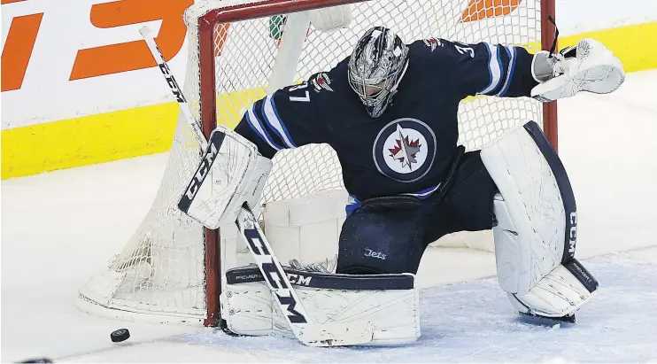  ?? — KEVIN KING ?? Winnipeg Jets goaltender Connor Hellebuyck is priming himself to carry a major load of games as the team pushes toward the post-season.