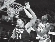  ?? Ezra Shaw / Getty Images ?? Duke’s Mark Williams, right, slams home a dunk over Texas Tech’s Marcus Santos-Silva to score two of his 16 points Thursday night.