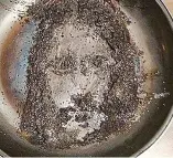  ??  ?? Heavenly vision: Is that really the face of Christ in a burnt frying pan?