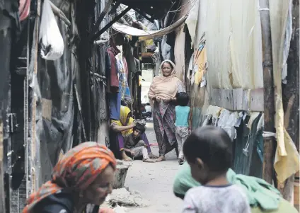  ?? Picture: AFP ?? BORROWED TIME. Rohingya refugees outside their shelters in New Delhi yesterday. The Indian government is to put its case to the country’s Supreme Court for expelling up to 40 000 Rohingya refugees.