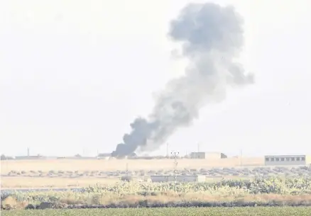  ?? REUTERS ?? Smoke rises from the Syrian side of the border as it is pictured from the Turkish town of Akcakale in Sanliurfa province, Turkey, on Wednesday.