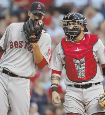  ?? AP PHOTO ?? MOUND OF TROUBLE: Rick Porcello chats with catcher Sandy Leon during last night’s game in St. Louis, in which the Sox starter allowed four runs in six innings. Porcello finished with a no-decision as the Sox rallied to win in 13 innings, 5-4.