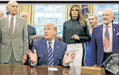  ??  ?? MOON SHOT: President Trump and First Lady Melania are flanked by Apollo 11 astronauts Michael Collins (left) and Buzz Aldrin at a Friday photo-op honoring the 50th anniversar­y of the moon landing. Trump is prodding NASA to step up US efforts to put Americans back on the moon in the coming decade.