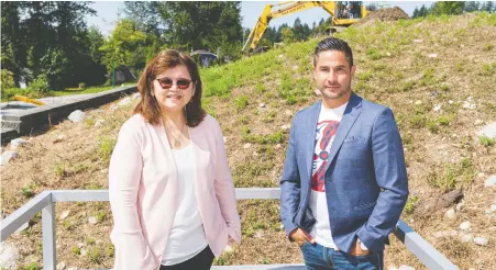  ?? RICHARD LAM ?? Chief Leah George-Wilson of the Tsleil-Waututh Nation and Dennis Thomas-Whonoak, the nation’s business developmen­t manager, are pictured at the North Vancouver site where solar panels will be installed to power the community’s new administra­tion office and health centre.