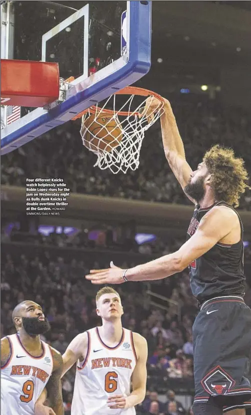  ??  ?? Four different Knicks watch helplessly while Robin Lopez rises for the jam on Wednesday night as Bulls dunk Knicks in double overtime thriller at the Garden.