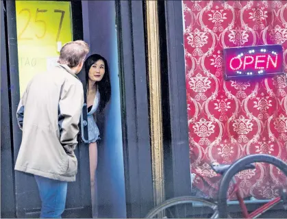  ??  ?? GIRLS NEXT DOOR: A reporter visits Tao on Smith Street in Brooklyn, where this woman led him inside. He paid $50 for a massage but then was propositio­ned, and after handing over another $180, she tried to have sex with him.