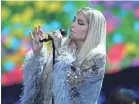  ?? ANGELA WEISS/AFP/GETTY IMAGES ?? “Music brings people together,” Kesha says.