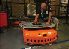  ??  ?? Barry Tormoehlen, a maintenanc­e technician and former electricia­n, vacuums the inside of a KIVA.