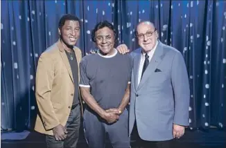  ?? Jay L. Clendenin Los Angeles Times ?? MATHIS is flanked by Kenny “Babyface” Edmonds, left, and Clive Davis at the Grammy Museum.