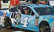  ?? PAUL SANCYA — ASSOCIATED PRESS ?? Kevin Harvick’s son, Keelan, rides into Winner’s Circle with his father after a NASCAR Cup Series race at Michigan Internatio­nal Speedway in Brooklyn, Mich., on Aug. 12.