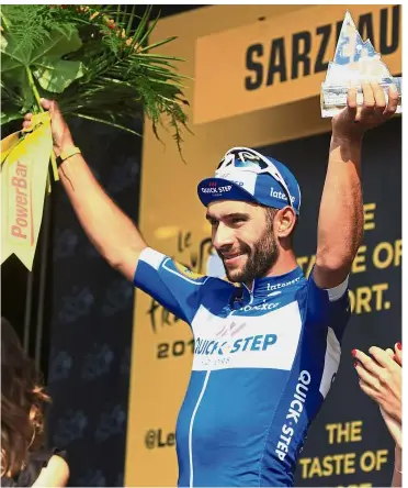  ?? — AP ?? Giving his all: Fernando Gaviria of Colombia celebratin­g on the podium after the fourth stage of the Tour de France on Tuesday.