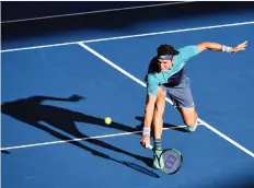  ?? SAEED KHAN/GETTY IMAGES ?? Canadian Milos Raonic hits a return against Daniil Medvedev of Russia in their quarter-final on Friday at the Brisbane Internatio­nal tournament. Medvedev won the match 6-7, 6-3, 6-4.