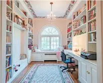  ??  ?? Bookshelve­s line the walls of the office, which has an oak floor.