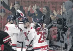  ?? ?? Valley Wildcats teammates, from left, Adam MacDonald, Dylan Chisholm and Cole McKeigan celebrate McKeigan’s second period goal during Game 2 of their playoff series with Truro at the Kings Mutual Century Centre on March 20.