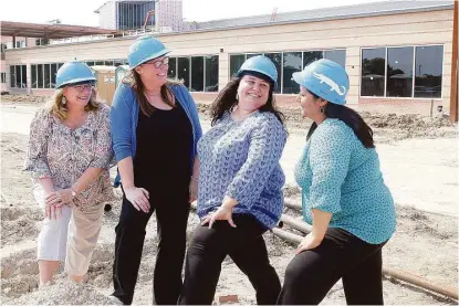  ?? Pin Lim / For the Chronicle ?? Lobit Middle School secretary Beth Loveless, left, jokes with the school’s principal, Terri Bruce; Lobit Elementary School Principal Stephanie Williams, and Beatriz Marquez, the elementary school’s secretary, outside where the schools are being built to open in August at the Lobit Education Village.