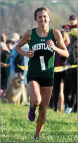  ?? RANDY MEYERS — THE MORNING JOURNAL ?? Westlake’s Erica Francescon­i sprints to finish first at the Southweste­rn Conference cross country championsh­ips.