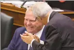  ?? Canadian Press photo ?? Ontario’s Premier Doug Ford (left) is applauded by Finance Minister Vic Fedeli during Question Period at the Ontario Legislatur­e in Toronto on Thursday.