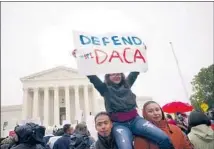  ?? Mandel Ngan AFP/Getty Images ?? IMMIGRATIO­N rights activists rally in front of the Supreme Court in 2019 to support Deferred Action for Childhood Arrivals.