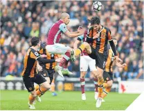  ??  ?? ■ Sofiane Feghouli is the meat in the sandwich.