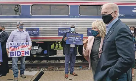  ?? Andrew Harnik Associated Press ?? JOE BIDEN and wife Jill speak to supporters in Cleveland on Wednesday. He is campaignin­g in two key states, Ohio and Pennsylvan­ia.