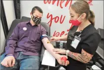  ?? Dan Watson/The Signal ?? Phlebotomi­st Dora Rubalcava, right, prepares Taylor Kellstrom to make a donation in the blood drive trailer at the West Coast Blood Center grand opening in Santa Clarita on Thursday.