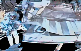  ?? NASA ?? This photo shows the view from NASA’s Andrew Morgan’s helmet cam as Italian astronaut Luca Parmitano works outside the space station during a spacewalk Saturday.