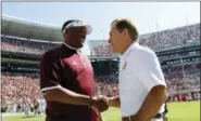  ?? BUTCH DILL — THE ASSOCIATED PRESS FILE ?? In this file photo, Texas A&M head coach Kevin Sumlin, left, and Alabama head coach Nick Saban shake hands before a game. The SEC West could be all but decided this Saturday. The leader will be determined in Tuscaloosa, Alabama, when the top-ranked...