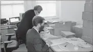  ?? Olivia Morley ?? Floyd County Elections Board member John Scott Husser and Elections Clerk Vanessa Waddell sort absentee ballots.