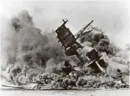  ?? Associated Press file photo ?? Smoke rises from the battleship USS Arizona as it sinks during the Japanese attack on Pearl Harbor, Hawaii. The day continues to live in infamy.