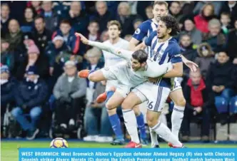  ??  ?? WEST BROMWICH: West Bromwich Albion’s Egyptian defender Ahmed Hegazy (R) vies with Chelsea’s Spanish striker Alvaro Morata (C) during the English Premier League football match between West Bromwich Albion and Chelsea at The Hawthorns stadium. — AFP