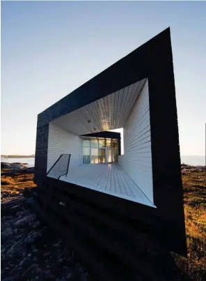  ??  ?? Above: The Long Studio at Joe Batt’s Arm is one of four architectu­rally striking studios available to artists through the Fogo Island Arts residency program. Opposite: Under the stilted, cantilever­ed guest wing at Fogo Island Inn; wool coat by Berluti,...