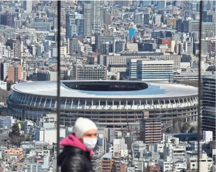  ?? JAE C. HONG/AP ?? The New National Stadium, a venue for the opening and closing ceremonies of the 2020 Tokyo Olympics, is seen from Shibuya Sky observatio­n deck in Tokyo. The Summer Games are postponed until 2021.