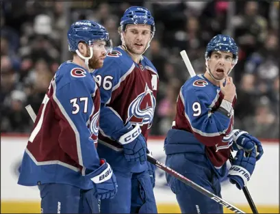  ?? AARON ONTIVEROZ — THE DENVER POST ?? Colorado’s Mikko Rantanen, center, speaks with J.T. Compher (37) and Evan Rodrigues (9) as they face off with the Tampa Bay Lightning at Ball Arena earlier this month.