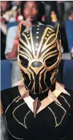  ?? CHIBA YASUYOSHI/GETTY IMAGES ?? A cosplayer gets ready to watch Black Panther in Nairobi, Kenya.