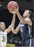  ?? John Hefti / Associated Press ?? Connecticu­t’s Napheesa Collier, right, shoots over California’s Kristine Anigwe in their game Saturday.