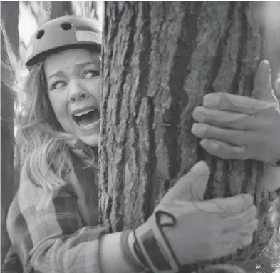  ?? KIA MOTORS AMERICA VIA AP ?? An image from Kia Motors America’s Super Bowl spot in which Melissa McCarthy humorously takes on political causes like saving whales, ice caps and trees, to promote the fuel efficiency of its 2017 Niro crossover.